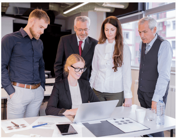 Team of professionals reviewing financial reports together