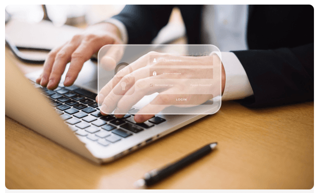 Professional typing on a laptop with a login overlay