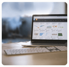 Laptop displaying analytics dashboard on a desk