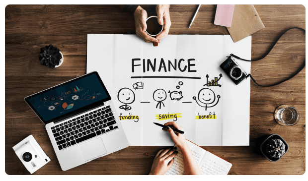 Laptop, camera, and a hand-drawn finance sketch showing funding, saving, and benefit