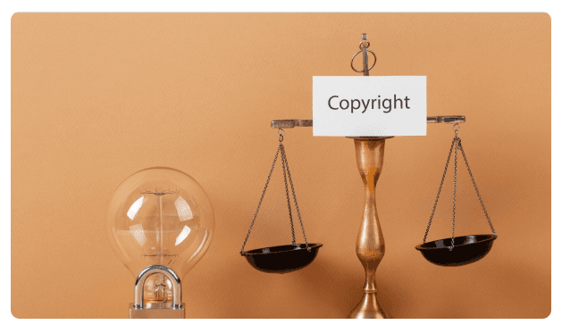 Scale of justice beside a lightbulb and a sign reading 'Copyright'
