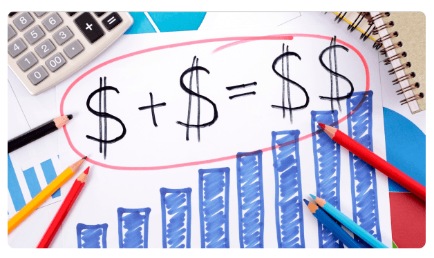 Bar chart with dollar sign equations surrounded by colored pencils