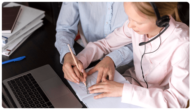 Support agent wearing a headset reviewing documents with a client