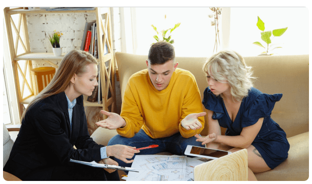 Advisor discussing estate planning with a family on a couch