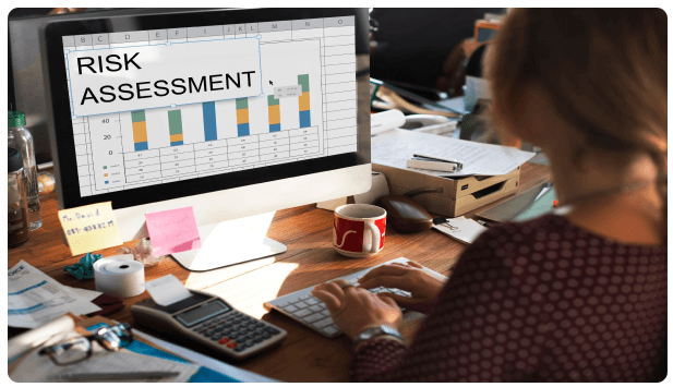 Analyst reviewing a risk assessment chart on a computer screen