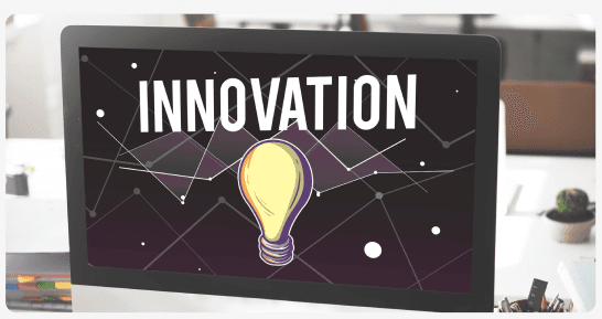 Computer screen displaying the word Innovation with a lightbulb graphic