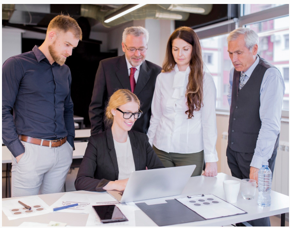 Team of professionals reviewing financial reports together