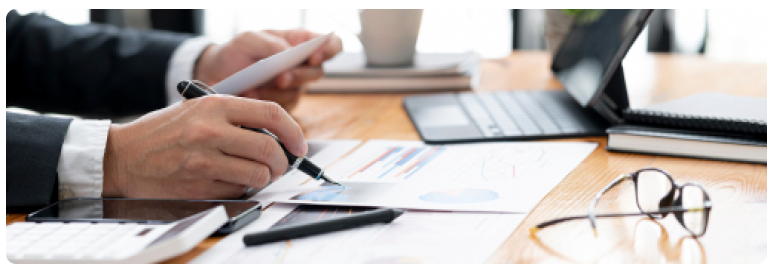 Accountant reviewing financial documents at a desk