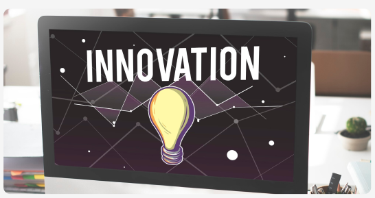 Computer screen displaying the word Innovation with a lightbulb graphic